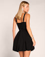 Back view of model in Adjustable Length Fit & Flare Midi Dress - Lace Black worn as a mini dress