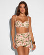 Model in Bombshell Bikini Top - Thorny Rose paired with matching swim cover up skirt