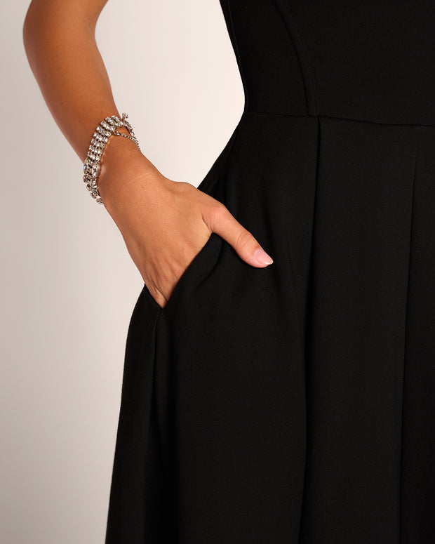 Close up of model hand in pocket of Adjustable Length Fit & Flare Midi Dress - Lace Black