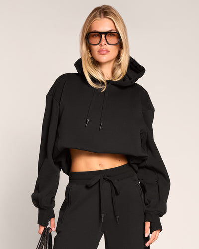 Model wearing Convertible Fleecey - Black cropped at the shortest length